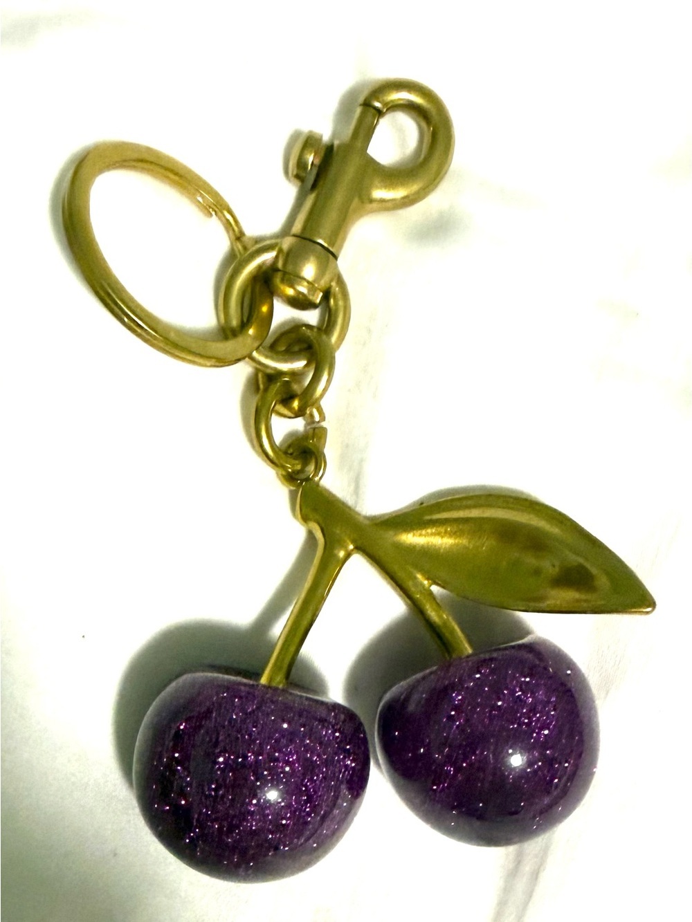 Bag Charm/Key Fob. Purple sparkle Cherries very heavy gold tone hardware! 💜💜